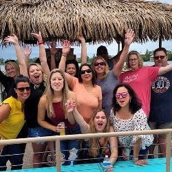 Family group on boat waving